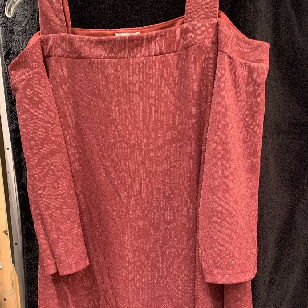 Beautiful cold-shoulder top with shark bite hem. New, never worn.
